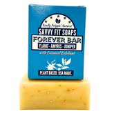 A box of Savvy Fit Soaps Forever Bar in Ylang, Amyris, and Juniper with an open soap, showcasing its plant-based, USA-made, and aromatic skincare formula.